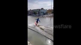 Thrill-seekers go wakeboarding and foil surfing in Oman floodwaters