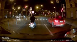 Motorcyclist teaches the manners of a car driver