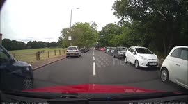 Bus gives way to a learner car but a van overtakes the bus followed by another car, the other car hits parked car but never stops