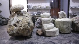 Palestinian man Salah al-Kahlout, 53, displays semi-precious stones at the Palestine Center