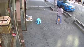 Woman and pet kitten dodge out-of-control car in China