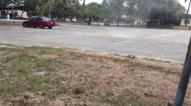 Dust devil tornado tears through car park in the Philippines
