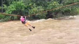 Trapped residents rescued using zip-line during tropical storm Kompasu in the Philippines
