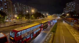 Queues of double-decker buses seen as Typhoon Kompasu nears Hong Kong