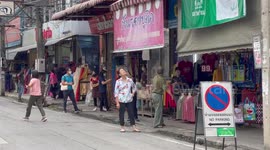 Wild snake caught slithering over electricity cables in Thailand