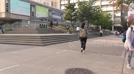 University of Toronto students line up on campus for COVID 19 vaccine on transit bus converted to mobile vaccination clinic to catch the last holdouts as vaccine mandates become a reality in Ontario for just about all participation in society