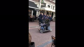'Don't try this at home!' Hilarious clip of old man's mobility scooter wheelie in Amsterdam goes viral