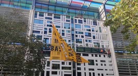 Abseiling police remove animal rights banner from Home Office