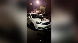 Chinese boy spotted sleeping on top of car after mother 'refuses to let him in house'