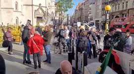 Julian Assange supporters congregate outside The Royal Courts of Justice