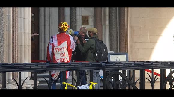 Assange supporters storm Royal Courts of Justice during extradition hearing