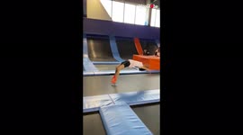 'Parkour girl CRASHES INTO the wall while doing back handsprings on trampoline '