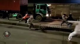 Fireworks and sickle-yielding youths get into intense clash on Indonesian streets