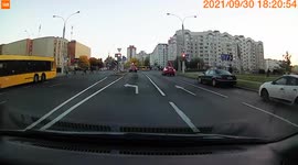 The driver in the car drives along the pedestrian crossing