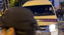 Protesters attack police van amid anger at death of boy, 15, at rally in Bangkok, Thailand