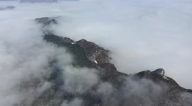 Snow Covers Mist-shrouded Baihua Mountain in Beijing, China