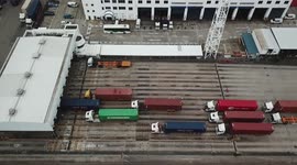 Container trucks queue up at Kwai Chung container port in Hong Kong