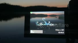 Photographer gives amazing behind-the-scenes look at how he creates light painting of swan