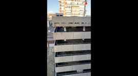 'FEARLESS parkour fanatic descends down a multi-story parking garage
'