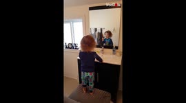 Mum catches 2-year-old son copying his dad by 'shaving' in the mirror