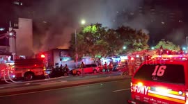 Multi-alarm fire tears through store in Harlem, NY, US