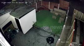 CCTV shows bungling thief lift up fence panel to try and steal patio furniture