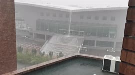 Rain turns university gymnasium stairs into waterfalls in China