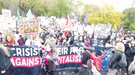 Large crowd of socialist protestors hold banners and signs and chant loudly at COP26 Protests at Glasgow 2021 United Kingdom