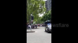 Protesters and police walk the streets together, Melbourne, Australia