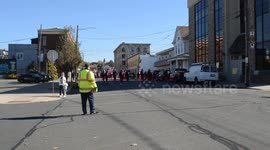 High School football play off parade of band and emergency apparatus