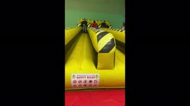 My son attempts the bungee run and on his third attempt the bungee breaks and he lands on top of his friend