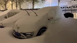 Heavy snow blankets vehicles and roads as strongest blizzard ever hits north Chinese city