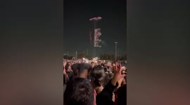 Moment dog owner holds their PET up in crowd at Astroworld festival