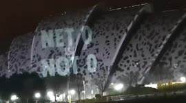 Eco-activists project 'BAN FRACKING NOW' and 'GO AWAY' onto COP26 SEC building