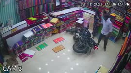 Motorbike crashes into Indian shop, almost hitting pregnant woman and several others
