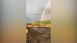 Double rainbow arcs over Indonesia after rain storm downpour