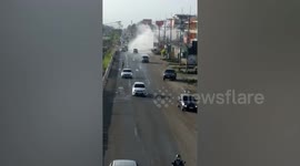 Water pipe explodes and creates huge fountain over road in Thailand