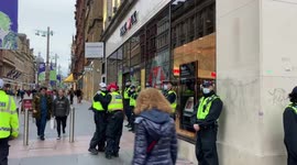 HSBC building is guarded by dozens of police officers during COP26 in Glasgow, UK