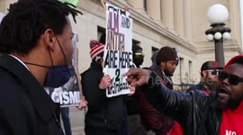 Two Protesters clash verbally in front of the courthouse in Kneosha Wisconsin for the Kyle Rittenhouse trail
