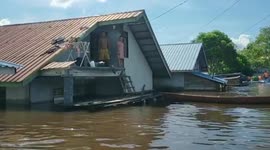 Worst flooding in 40 years slams western Indonesia as residents take to rooftops