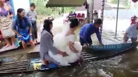 Couple gets married during floods in Indonesia