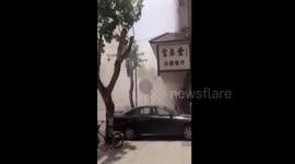 Locals flee building collapse in East China