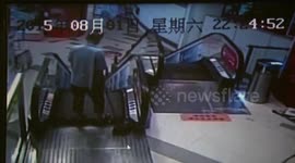 Cleaner gets foot stuck in escalator