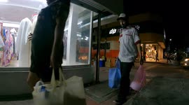 Time lapse of people shopping in downtown Hermosillo Mexico, at night walking among the lights of the city a few weeks before Christmas and New Years. Daily life