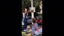 Touching moment volunteer reunites baby BAT with mother after offspring fell to ground