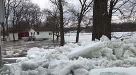 Massive ice chunks pile up outside Iowa house as frozen river begins to crack