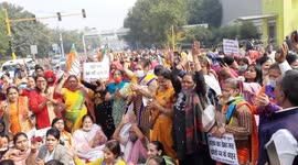 Delhi Pradesh BJP Mahila Morcha activist during a Protest against New liquor Policy implemented by AAP Govt.