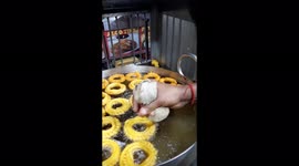 A Preparation of stylish sweet called Imirti in street market.