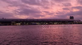 Sunset colors and the main railway station in Amsterdam, Holland