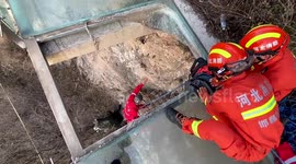 Firefighters rescue woman trapped on mountainside after falling through abandoned glass walkway in northern China